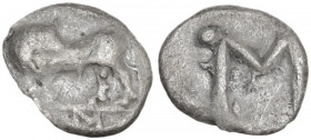 Greek Italy. Southern Lucania, Sybaris. AR Obol, c. 550-510 BC. Obv. Bull standing left, head reverted; V M in exergue. Rev. Large M V; pellets at cor...