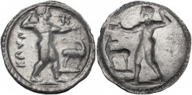 Greek Italy. Bruttium, Kaulonia. AR Stater, c. 525-500 BC. Obv. KAVΛO (O in right field). Apollo, nude, walking right, holding laurel branch in uprigh...