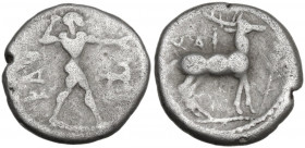 Greek Italy. Bruttium, Kaulonia. AR Third Nomos – Drachm, c. 475-425 BC. Obv. Apollo advancing right, holding branch; small daimon running right on Ap...