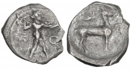 Greek Italy. Bruttium, Kaulonia. AR Obol, c. 480-388 BC. Obv. Apollo advancing right, holding branch; to right, O(?). Rev. Stag standing right; to rig...