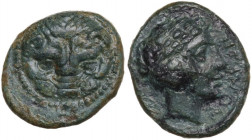 Greek Italy. Bruttium, Rhegion. AE 13.5 mm. circa 351-280 BC. Obv. Facing lion-mask with pointed ears. Rev. PHΓINON. Head of Apollo right; behind, dol...