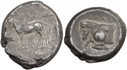 Sicily. Gela. AR Tetradrachm, c. 420-415 AD. Obv. Slow quadriga driven left by charioteer, holding reins and kentron; above, Nike flying left to crown...