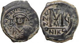 Maurice Tiberius (582-602). AE Follis, Nicomedia mint, 1st officina. Dated RY 6 (587/8). Obv. DN mAVI DIRE TI(?). Crowned and cuirassed bust facing, h...