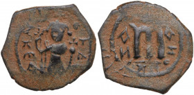 Umayyad Caliphate. Arab-Byzantine coinage (Pseudo-Byzantine type). AE Fals, Emesa mint, c. 660-680. Obv. Caliph standing facing, holding scepter and g...