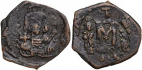 Constantine IV Pogonatus, with Heraclius and Tiberius (668-685). AE Follis. Syracuse mint. Struck 668-674 AD. Obv. Helmeted and cuirassed facing bust,...