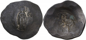 Andronicus I Comnenus (1183-1185). BI Aspron Trachy. Constantinople mint. Obv. MP-ӨV. The Virgin standing facing on dais, holding nimbate head of infa...