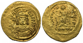 (Gold. 4.43g 23mm) MAURICE TIBERIUS (582-602).Solidus. Constantinople.
Helmeted, draped and cuirassed bust facing, holding globus cruciger.
Rev: Ang...