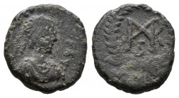 (Bronze.1.19g 12mm) Justinian I. 527-565. AE pentanummium 
Bust right/ monogram, all in wreath