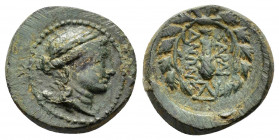 LYDIA. Sardes.(2nd-1st centuries BC).Ae.

Obv : Laureate head of Apollo right.

Rev : ΣAPΔIA NΩN.
Club right within wreath; monogram to right.
SNG Cop...