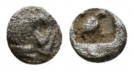 Caria. Mylasa circa 420-390 BC. Tetartemorion. Forepart of roaring lion left, head turned back / Bird standing right, pellets flanking, all wihtin inc...