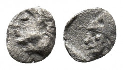 Asia Minor. Uncertain mint circa 520-450 BC. Hemitetartemorion AR 4 mm., 0,09g. Archaic male head to left / Athena in corinthian helmet? to left.