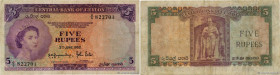 Country : CEYLON 
Face Value : 5 Rupees 
Date : 03 juin 1952 
Period/Province/Bank : Central Bank of Ceylon 
Catalogue reference : P.51 
Alphabet - si...