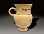 ceramic jug with ring handle, greek period circa 500 - 300 BC. traces of black glazing still present
Height: 10.4 cm