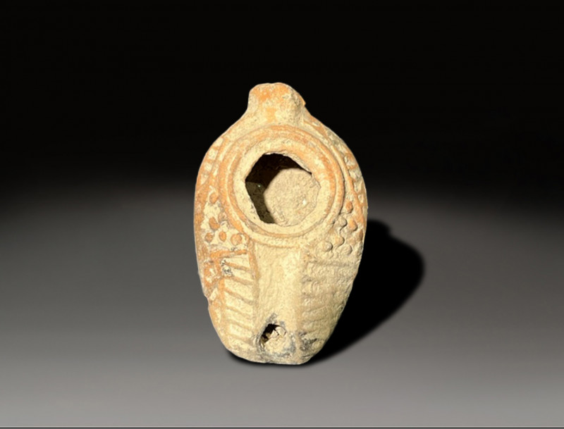 ceramic samiritan oil lamp with rich decorations circa 300 - 400 AD
Height: 11....