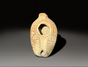 ceramic samiritan oil lamp with rich decorations circa 300 - 400 AD
Height: 11.4 cm