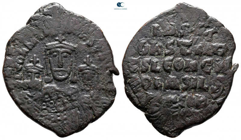 Basil I, with Leo VI and Constantine VII AD 867-886. Constantinople
Follis Æ
...