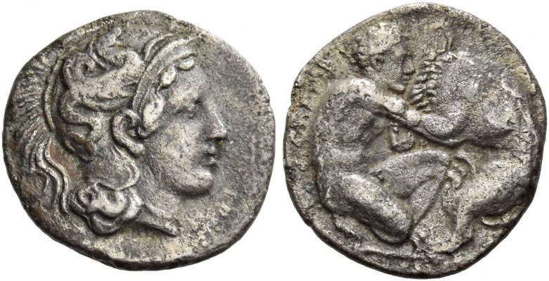 Calabria, Tarentum. Diobol circa 380-325 BC, AR 1.05 g. Head of Athena r., weari...