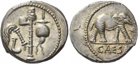 Denarius, mint moving with Caesar 49-48. AR 4.07 g. Pontifical emblems: culullus, aspergillum, axe and apex. Rev. Elephant r., trampling dragon; in ex...