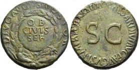 Octavian as Augustus, 27 BC – 14 AD. Divus Augustus. Sestertius 34-35 AD, Æ 27.10 g. Shield within wreath inscribed OB / CIVES / SER supported by two ...