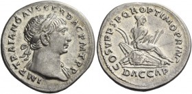 Trajan, 98 – 117. Denarius 107-108, AR 3.22 g. Laureate head r. with drapery on l. shoulder. Rev. Dacian seated r. on pile of arms, hands bound behind...
