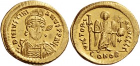 Justinian I, 527 – 565. Solidus 527-538, AV 4.40 g. Helmeted, diademed and cuirassed bust three-quarters facing, holding spear and shield decorated wi...