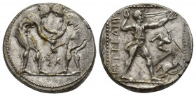 Pamphylia, Aspendos AR Stater. (23mm, 11.1 g). Circa 380-325 BC. Two wrestlers grappling; ΣK between / Slinger in throwing stance to right; EΣTFEΔIIY[...