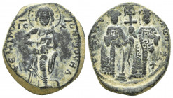 Constantine X Ducas and Eudocia AD 1059-1067. Constantinople Follis Æ (27mm, 11.3 g). +EMMANOVHΛ; Christ standing facing on footstool, wearing nimbus ...