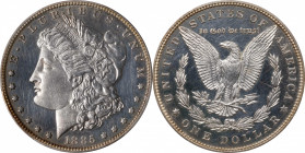 1885 Morgan Silver Dollar. Proof-62 (PCGS).
The surfaces are silver at the center, changing to iridescent golden toning at the borders, quite attract...