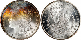 1885-CC Morgan Silver Dollar. MS-66+ (PCGS).
Crescents of vivid multicolored bag toning along the upper obverse are sure to result in a premium price...