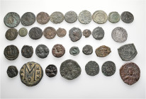 A lot containing 33 bronze coins. Including: Roman Imperial, Byzantine, Crusaders, Cilician Armenia. About very fine to good very fine. LOT SOLD AS IS...