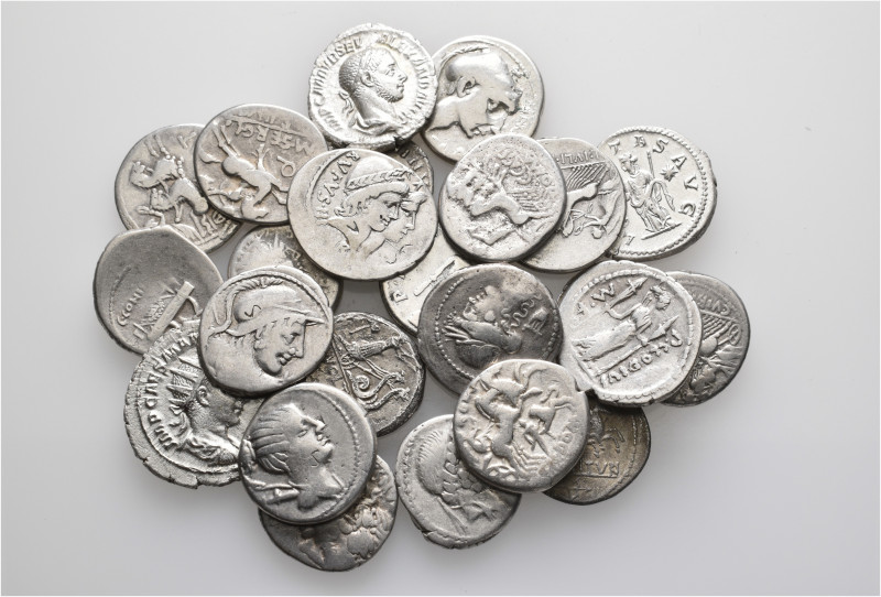 A lot containing 23 silver coins. Including: Roman Republican and Roman Imperial...