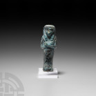 Egyptian Glazed Shabti of Hor-(em)-Khebit Third Intermediate Period, 21st Dynasty, 1069-943 B.C. A blue-glazed composition shabti with detailing in a ...