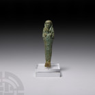 Egyptian Glazed Shabti of Weni Son of Merhoritef Late Period, 26th Dynasty, 665-525 B.C. A glazed composition shabti with arms folded across the chest...