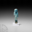 Egyptian Glazed Overseer Shabti Third Intermediate Period, 21st Dynasty 1081-931 B.C. A blue-glazed composition shabti formed as an overseer, reis, we...