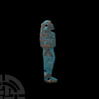 Egyptian Baboon-Headed Hapi Four Sons of Horus Amulet Late Period, circa 500 B.C. A blue-glazed composition amulet formed as baboon-headed Hapi with s...