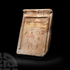 Egyptian Stela Representing a False Door Middle Kingdom, 11th-12th Dynasties, circa 1991-1786 B.C. A limestone stela fashioned as a simplified ‘false-...