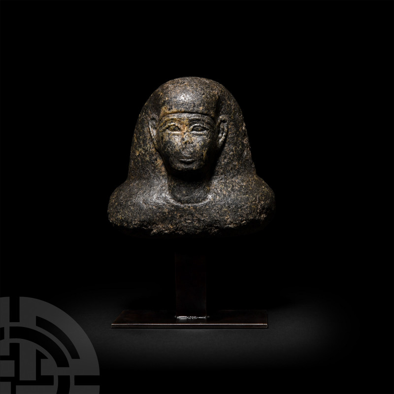 Egyptian Diorite Bust of a Dignitary Late Period, 525-330 B.C. A diorite bust of...