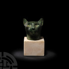 Egyptian Bronze Cat Head for the Goddess Bastet Late Period, 664-332 B.C. A well-proportioned bronze cat head modelled in the round with stylised feat...
