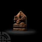 Egyptian Wooden Coptic Shrine 5th-7th century A.D. A carved wood shrine of pentagonal form with Egyptian symbols: the royal cobra, uraeus, the sun-dis...