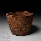 Egyptian Woven Reed Basket New Kingdom, 18th Dynasty, circa 1569-1315 B.C. A neat, tight weave, palm leaf or halfa grass coiled and woven basket, comp...