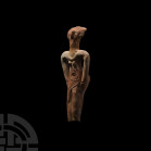 Egyptian Terracotta Concubine Figurine Second Intermediate Period-early New Kingdom, circa 1660-1500 B.C. A stylised, nude terracotta female figure mo...