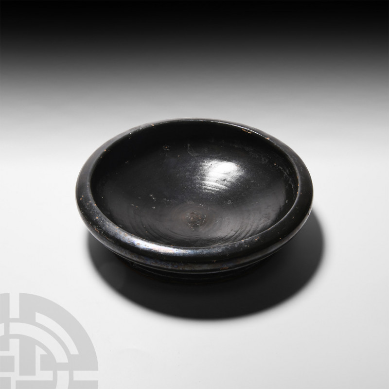 Greek Black-Glazed Athenian Plate 5th-3rd century B.C. A black-glazed plate or s...