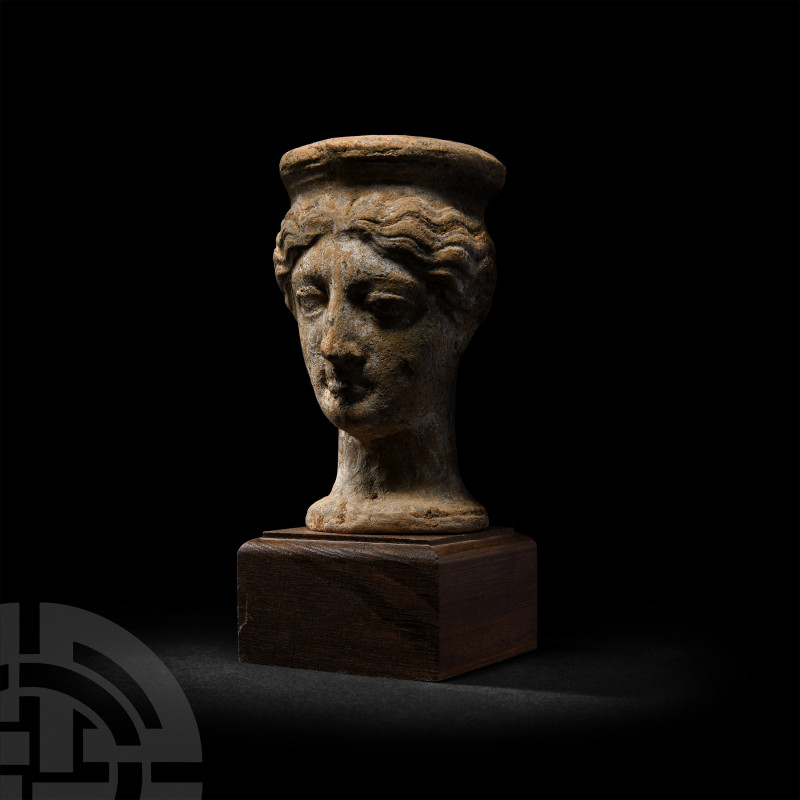 Greek Terracotta Head of a Female Wearing Polos 5th-3rd century B.C. A hollow-fo...
