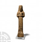 Greek Terracotta Figure of a Kore 5th century B.C. A terracotta figure modelled as a female kore standing on an integral plinth, wearing a polos, semi...