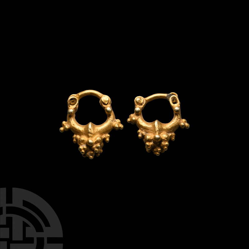 Parthian Gold Earring Pair 3rd century B.C.-3rd century A.D. A matched pair of g...