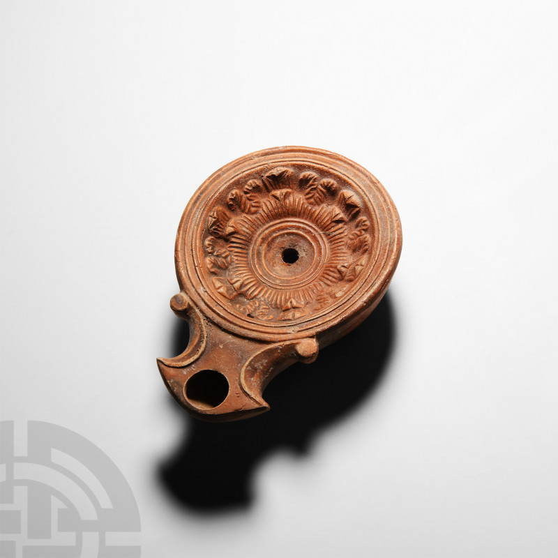 Roman 'Chancery Lane' Terracotta Oil Lamp 1st century A.D. A terracotta oil lamp...