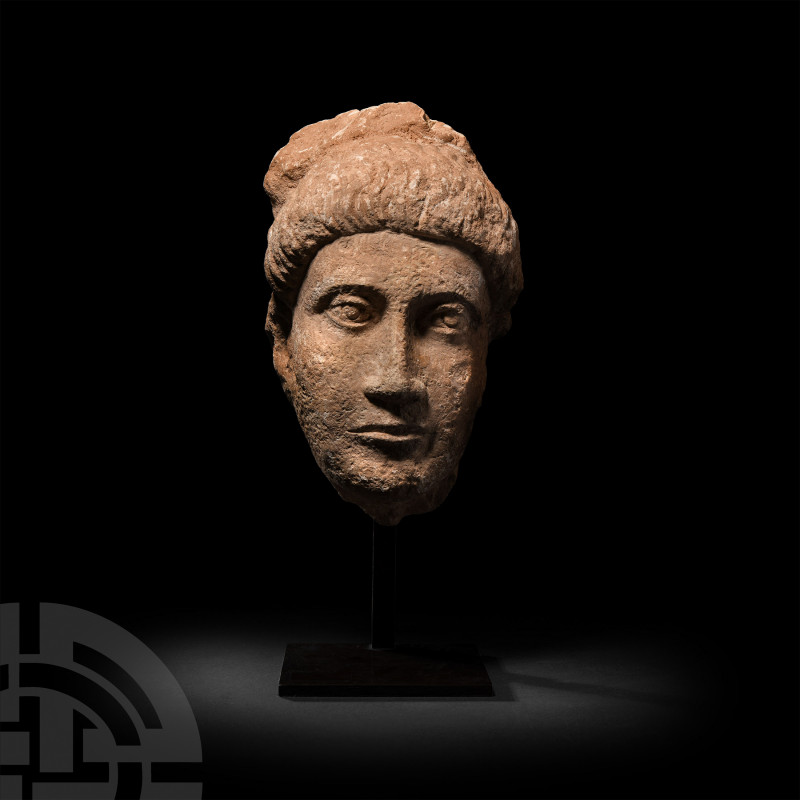 Roman Limestone Head of a Man 4th-5th century A.D. A life-size limestone head of...