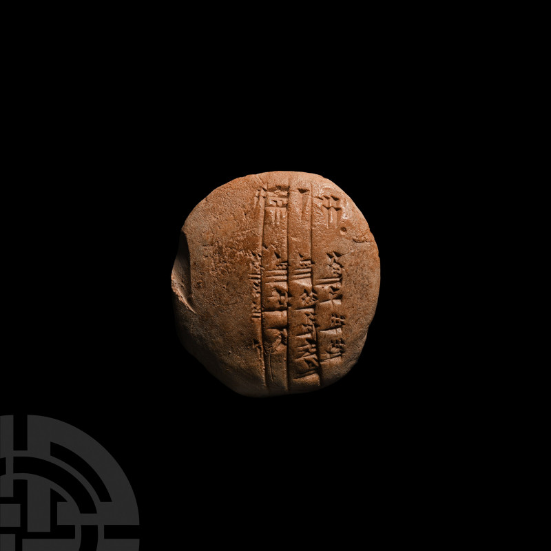 Ur III Cuneiform School Tablet 3rd millennium B.C. A sub-circular ceramic tablet...