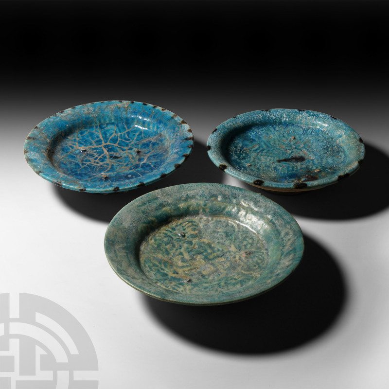 Nishapur Blue-Glazed Dish Collection 10th-13th century A.D. A trio of wheel-thro...