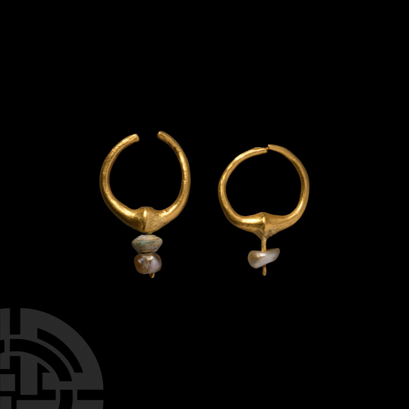 Gold Earring Pair 1st millennium B.C. A pair of gold hoop earrings, each compose...